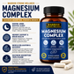 Bottle of Warrior Strong Wellness Magnesium Complex supplement with capsules on a light surface.