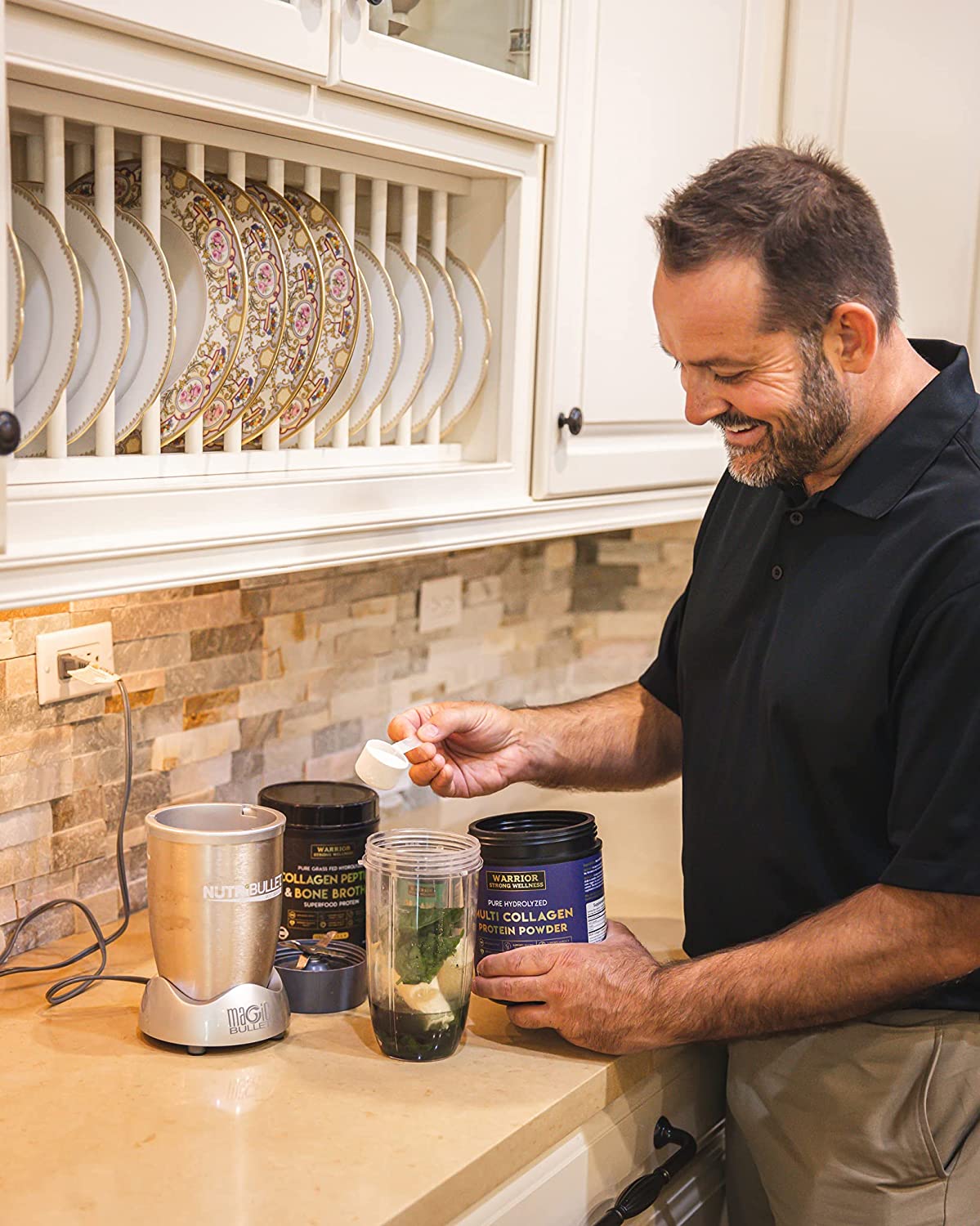 Person making a healthy smoothie with Warrior Strong Wellness collagen supplements, fresh spinach, and fruit in a blender for daily nutrition and wellness support.