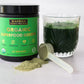 Warrior Strong Wellness Organic Superfood Greens with a scoop of greens powder and a mixed green drink for energy, digestion, detoxification, and immune support.