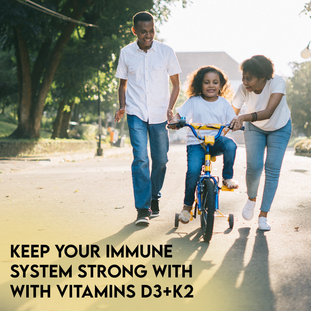 Family enjoying an active outdoor lifestyle with a message promoting Warrior Strong Wellness Vitamins D3 & K2 for immune system support and daily wellness.